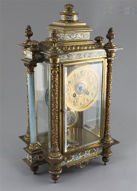 An early 20th century French ormolu mounted and champleve enamel mantel clock, 16in.